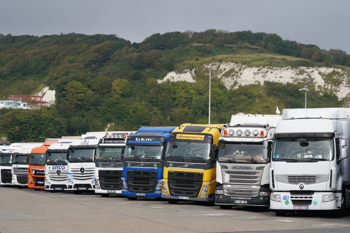 File photo dated 26/09/21 of lorries parked in Dover, Kent. Treasury minister Simon Clarke said the Government wanted to encourage HGV drivers who had left the profession to come back. Issue date: Thursday September 30, 2021. PA Photo. "There's a write out campaign, encouraging people who may want to return to being HGV drivers to do just that," he told the BBC's Today programme. See PA story CONSUMER Shortages . Photo credit should read: Gareth Fuller/PA Wire